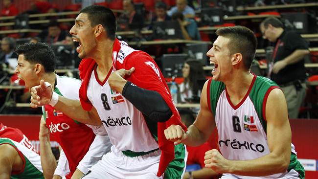 Mexico's Gustavo Ayon and  Roman Martinez react on the bench at the FIBA Americas Championship basketball game against Jamaica in Caracas